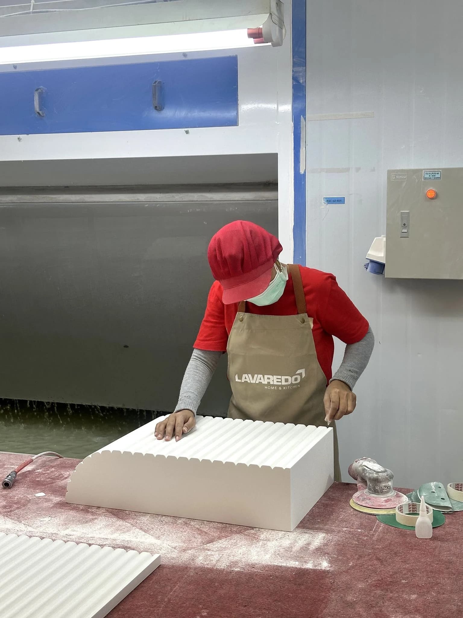 Lavaredo specialist hand-sanding a sculpted furniture component