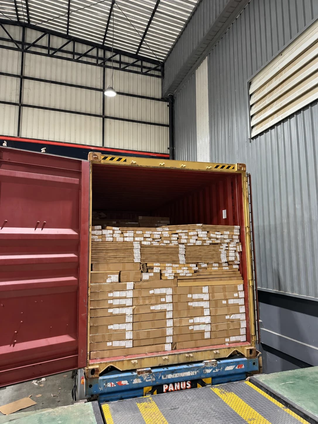 Packed cabinetry loaded into a shipping container at the Lavaredo factory